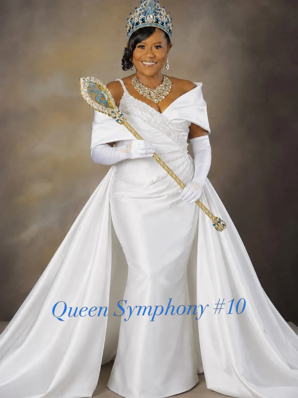 Full official royal portrait of Latarisha “Joy” Stanley, Queen Symphony X, including her gown, crown and the printed Queen Symphony #10 title